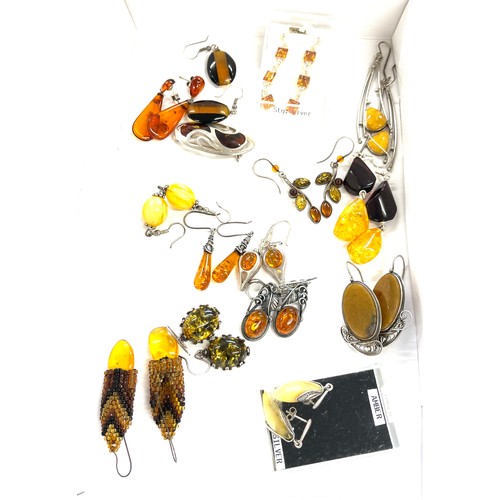 565 - Selection of mainly silver and amber style ladies costume jewellery