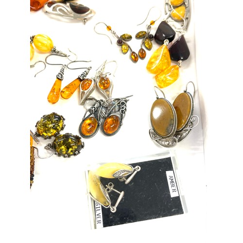 565 - Selection of mainly silver and amber style ladies costume jewellery