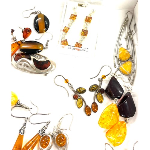 565 - Selection of mainly silver and amber style ladies costume jewellery