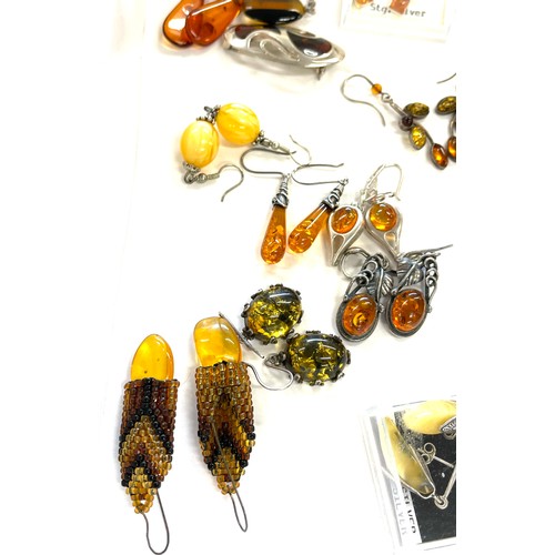 565 - Selection of mainly silver and amber style ladies costume jewellery