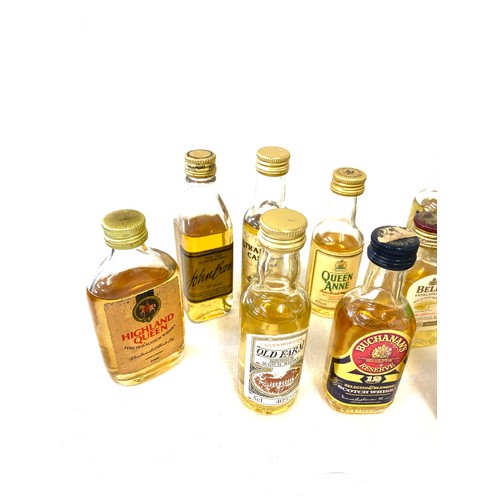 167 - Large selection of whiskey alcohol miniatures includes bells whiskey etc