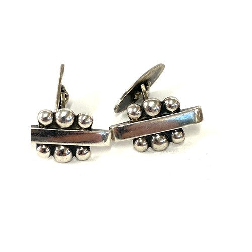 580 - Selection of named vintage silver jewellery includes N.E cufflinks, Denmark and 2 other Danish tie c... 