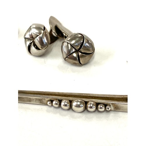 580 - Selection of named vintage silver jewellery includes N.E cufflinks, Denmark and 2 other Danish tie c... 