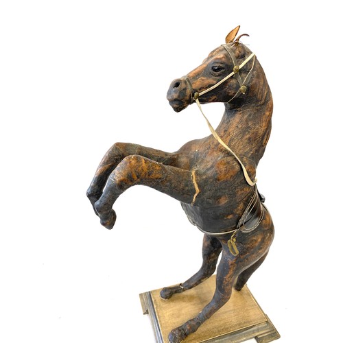 90 - Vintage leather prancing horse on stand, approximate overall height: 17 inches