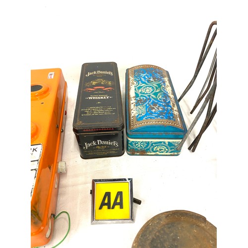 207 - Selection of miscellaneous to include advertising tins, the CMF safety link distress radio telephone... 