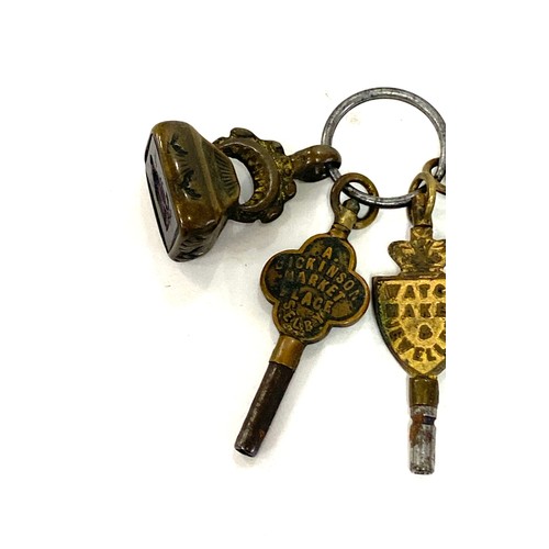 504 - Antique 19th century advertising watch keys with intaglio seal