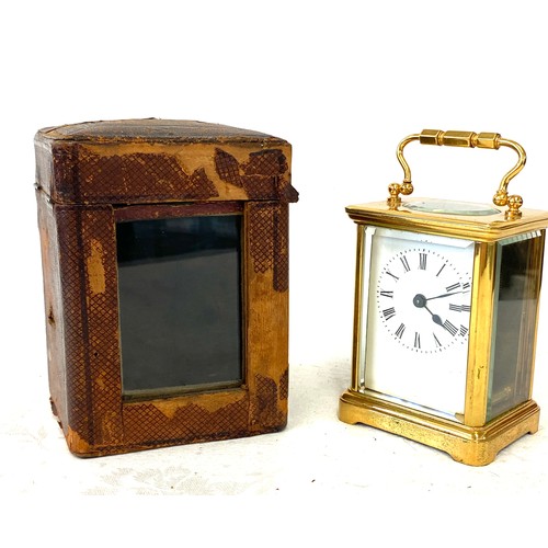 134 - French carriage clock with original case, winds up and ticks, no warranty given