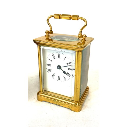 134 - French carriage clock with original case, winds up and ticks, no warranty given