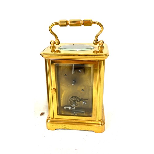 134 - French carriage clock with original case, winds up and ticks, no warranty given