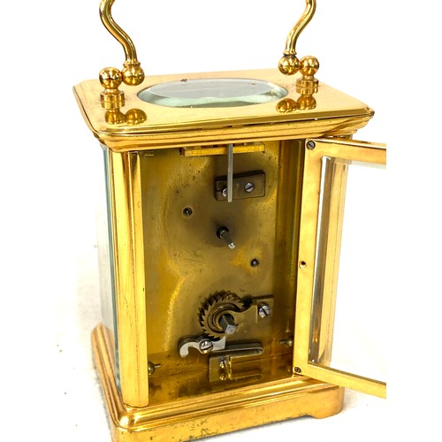 134 - French carriage clock with original case, winds up and ticks, no warranty given