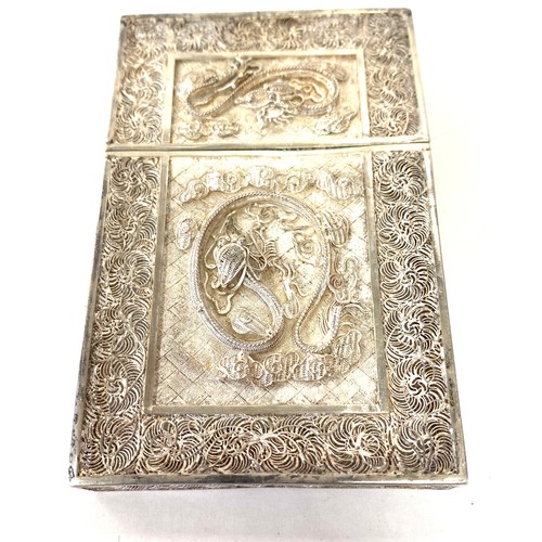 556 - Silver Filigree card case, approximate measurements 9.5cm by 6cm, overall good condition