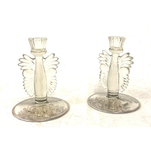 541 - Pair glass candlesticks, depicting owl faces, small chip to one of the candlesticks