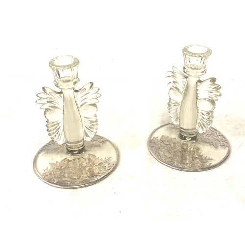 541 - Pair glass candlesticks, depicting owl faces, small chip to one of the candlesticks