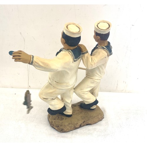 19 - Resin Laurel and Hardy statue measures approx 12 inches tall