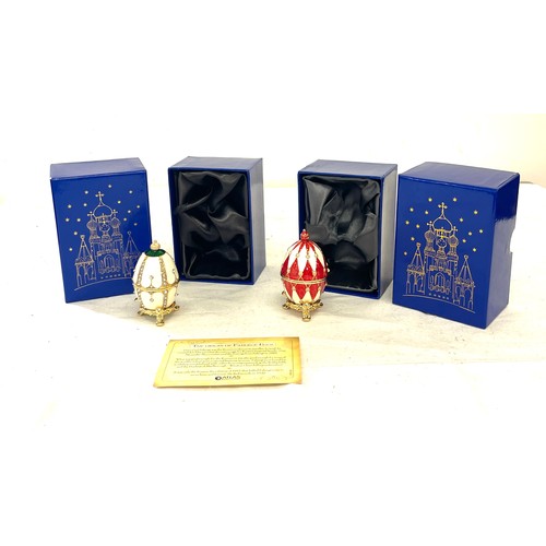 73 - 2 boxed small faberge eggs on stands, only one with paperwork