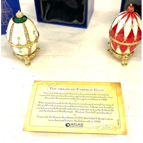 73 - 2 boxed small faberge eggs on stands, only one with paperwork