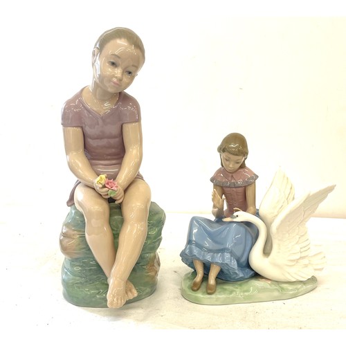 62 - Nao large girl figure, sitting on rocks, girl figure with swan, both in good overall condition