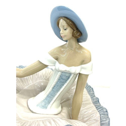 83 - Vintage Nao sitting lady, approximate measurements: Height 8.5 inches, Width 13.5 inches, overall go... 