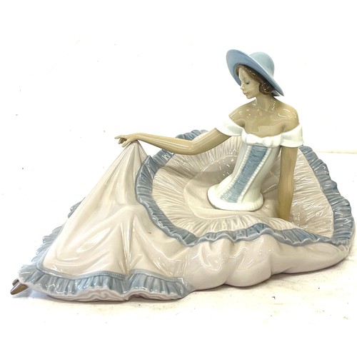 83 - Vintage Nao sitting lady, approximate measurements: Height 8.5 inches, Width 13.5 inches, overall go... 