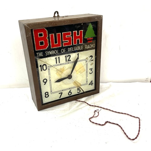 87 - Bush The symbol of reliable radio advertising clock, glass has been damage, overall measurements: He... 