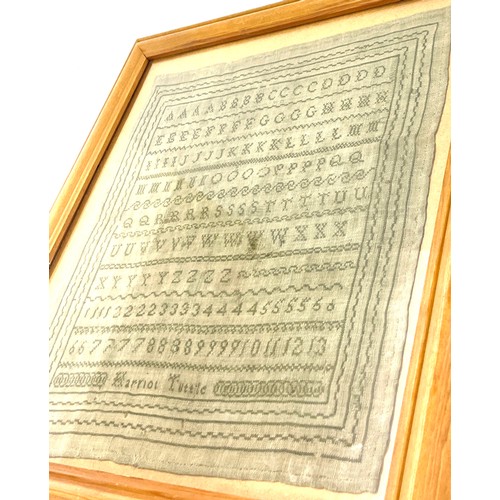 76 - Framed antique sampler in later frame by Harriot Tuttle, overall frame measurements 18 inches square