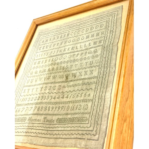 76 - Framed antique sampler in later frame by Harriot Tuttle, overall frame measurements 18 inches square