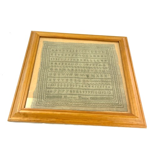 76 - Framed antique sampler in later frame by Harriot Tuttle, overall frame measurements 18 inches square