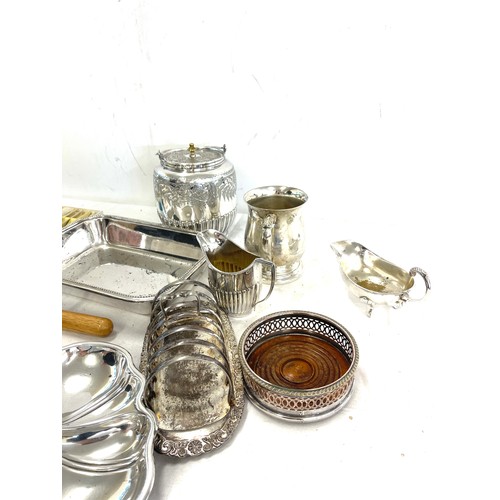 149 - Large selection of silver plated items to include cutlery, toast rack, biscuit barrel, condiments, t... 