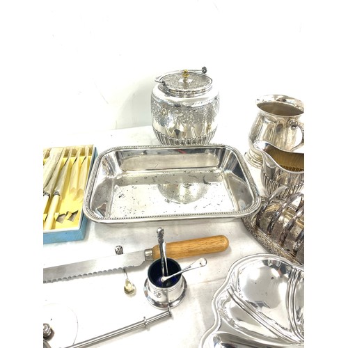 149 - Large selection of silver plated items to include cutlery, toast rack, biscuit barrel, condiments, t... 