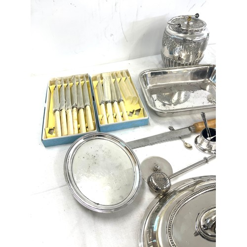 149 - Large selection of silver plated items to include cutlery, toast rack, biscuit barrel, condiments, t... 