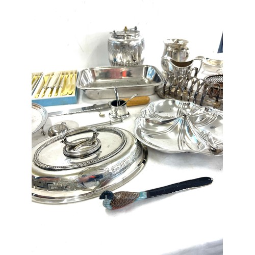 149 - Large selection of silver plated items to include cutlery, toast rack, biscuit barrel, condiments, t... 