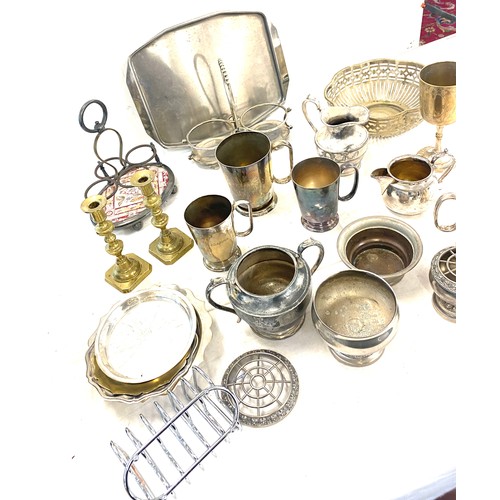 300 - Large selection of silver plated items to include candle sticks, toast rack etc