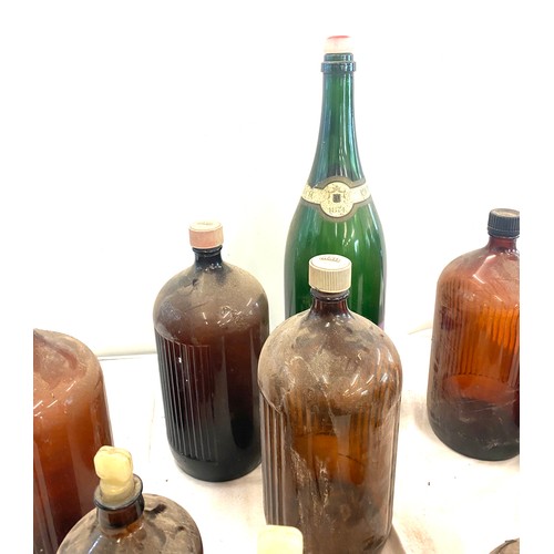 324 - Selection of large vintage M and B glass ale and champagne bottles