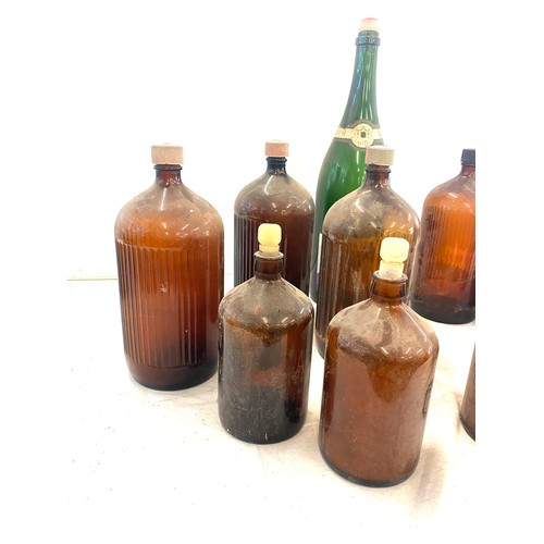 324 - Selection of large vintage M and B glass ale and champagne bottles