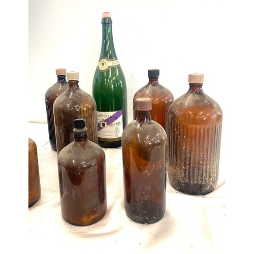 324 - Selection of large vintage M and B glass ale and champagne bottles