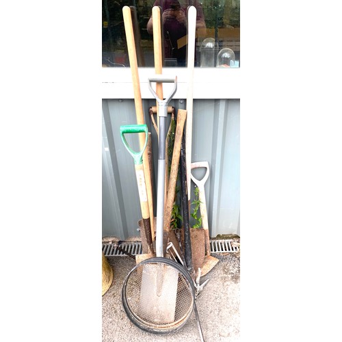 100E - Selection of garden tools to include pick axes, post hole diggers, spades etc.