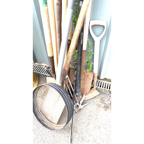 100E - Selection of garden tools to include pick axes, post hole diggers, spades etc.