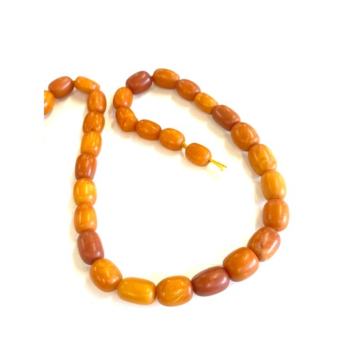 503 - Antique egg yolk amber bead necklace for re stringing total weight approx 42 grams, length 53cm