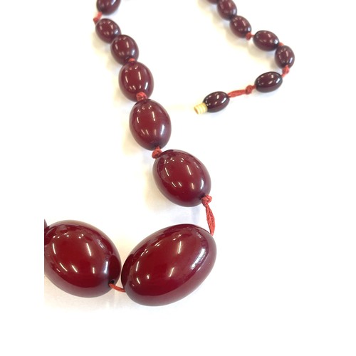 504 - Art deco cherry red amber bakelite bead necklace total weight 52 grams, no internal streaking length... 