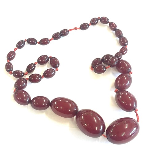 504 - Art deco cherry red amber bakelite bead necklace total weight 52 grams, no internal streaking length... 