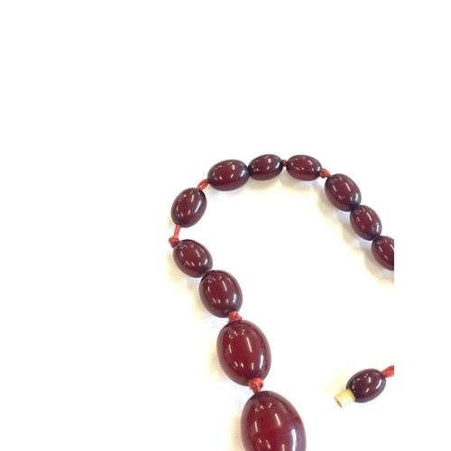 504 - Art deco cherry red amber bakelite bead necklace total weight 52 grams, no internal streaking length... 