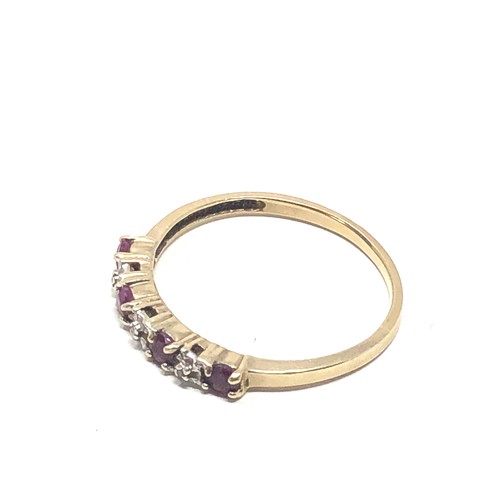 189 - 9ct gold ruby & diamond seven stone dress ring (1.4g)