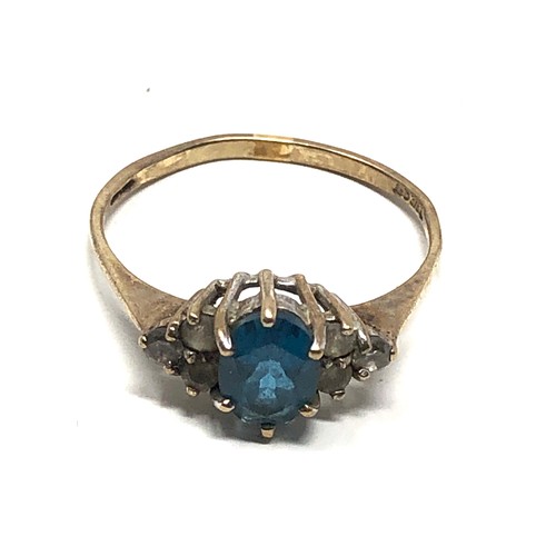 148 - 9ct gold blue topaz & clear stone ring (1.7g)