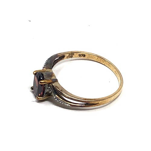 210 - 9ct gold garnet & diamond  ring (1.8g)
