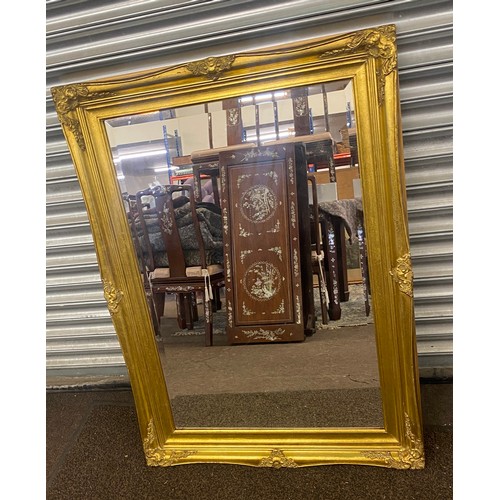 385 - Gilt framed mirror measures 42.5 inches length 31 inches wide