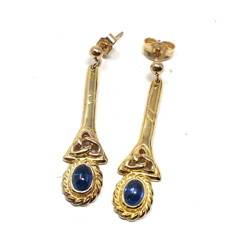 124 - 9ct gold sapphire celtic knot long drop earrings (3.9g)