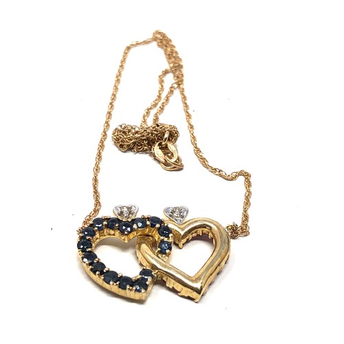 200 - 14ct gold diamond, ruby, & sapphire intertwined heart necklace (4.6g)