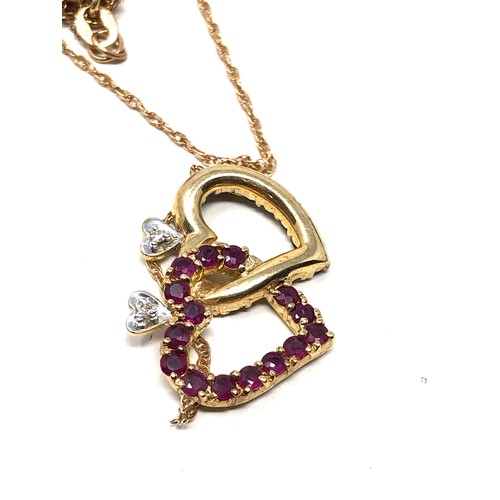 200 - 14ct gold diamond, ruby, & sapphire intertwined heart necklace (4.6g)