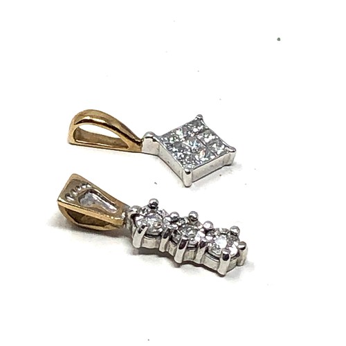 212 - 2 x 9ct gold diamond set pendants (1.1g)
