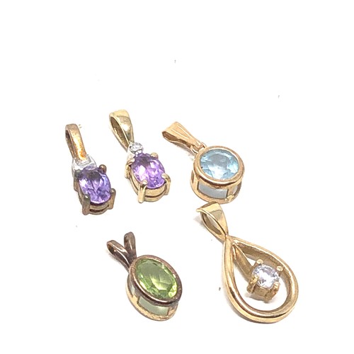 174 - 5 x 9ct gold gemstone pendants inc. amethyst, peridot, topaz, diamond & clear stone (2.8g)